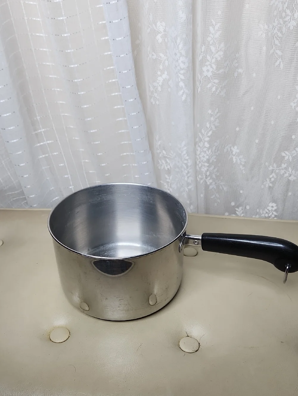 vintage Revere Ware 1801 stainless steel 8QT saucepan with a black handle